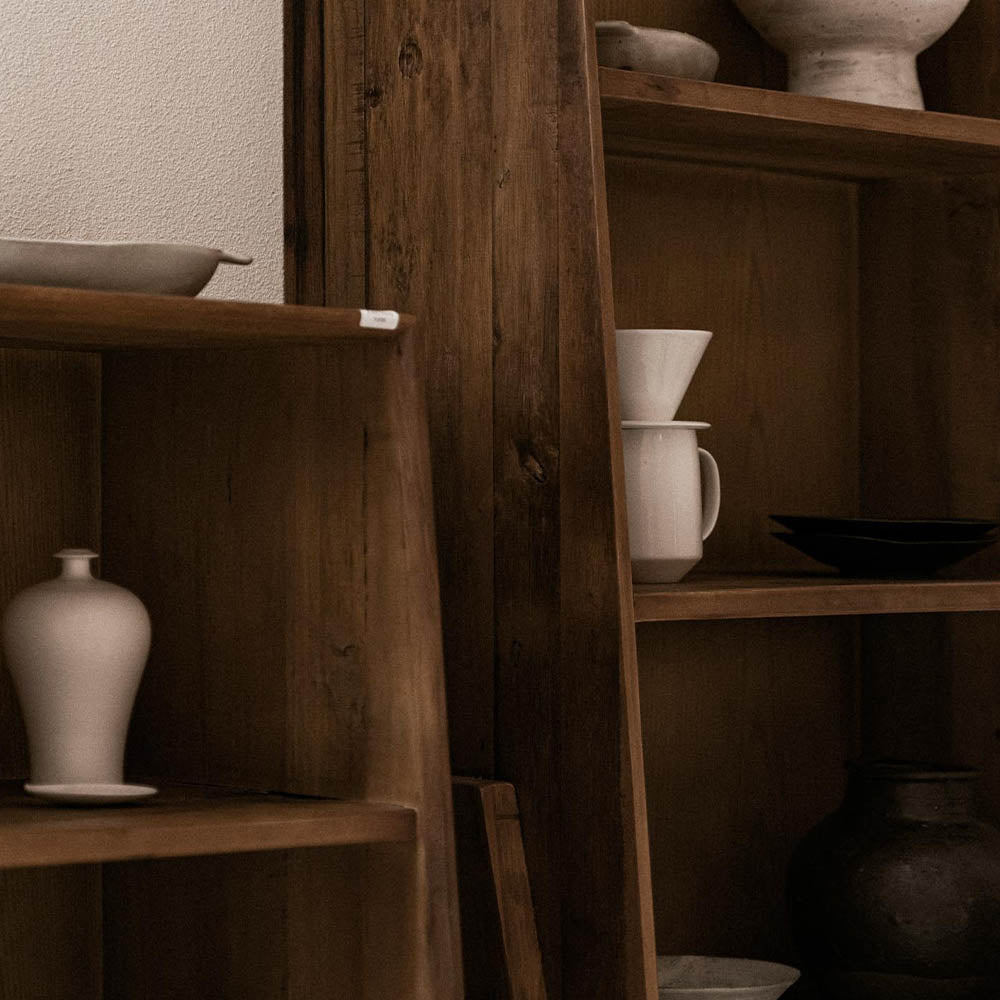 Curated antique and modern furnishings selected for a transitional home design